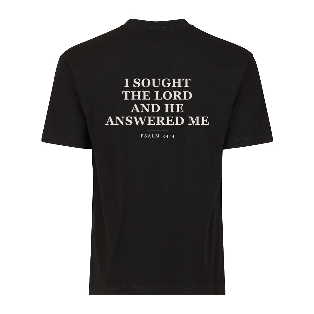 He Answers tee in black, Psalm 34:4 on the back